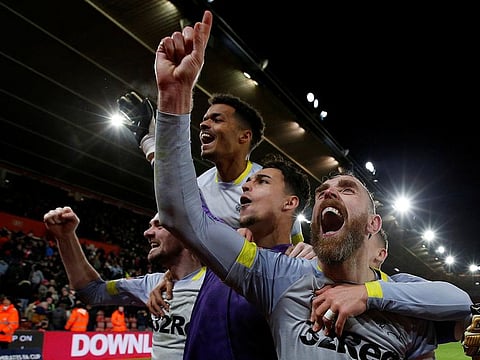 Derby County's Richard Keogh celebrates winning the penalty shootout with team mates.
