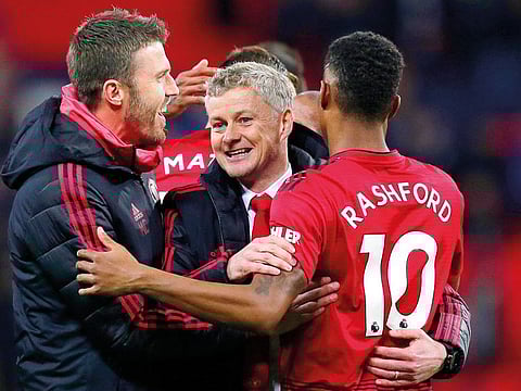 Manchester United caretaker manager Ole Gunnar Solskjaer (centre) celebrates with Marcus Rashford (right) after their win over Tottenham Hotspur at Wembley Stadium last week.