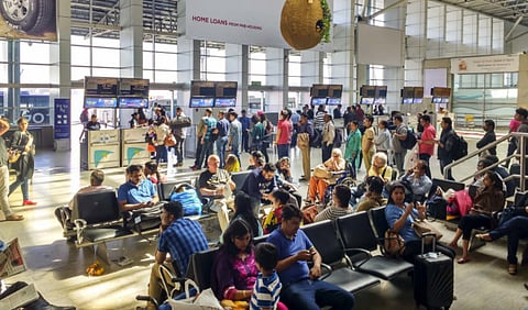 File picture: People queue up to board a flight while others wait for their flights at Chhatrapati Shivaji International Airport in Mumbai, India.