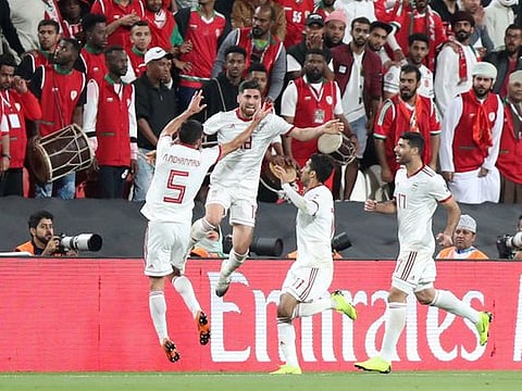 Iran's Alireza Jahanbakhsh celebrates scoring their first goal.