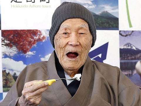 Japanese Masazo Nonaka, who was born 112 years and 259 days ago, eats his favorite cake as he receives a Guinness World Records certificate naming him the world's oldest man during a ceremony in Ashoro, on Japan's northern island of Hokkaido, in this photo taken by Kyodo April 10, 2018.