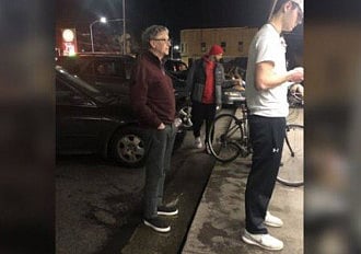 Bill Gates waits in line to get a burger.