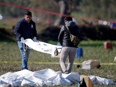 Forensic experts working in the area an oil pipeline explosion in Tlahuelilpan, Hidalgo state, Mexico, Saturday, Jan. 19, 2019. 