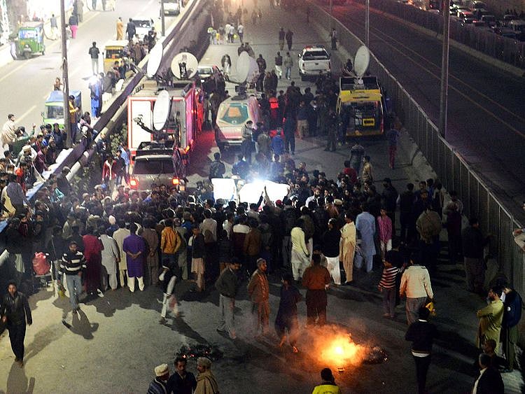 Relative and local residents burn tires