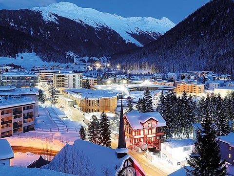 A view of the congress center, the building in centre, which hosts the World Economic Forum, WEF, illuminated by street lights at the eve of the annual meeting of the forum, in Davos. 