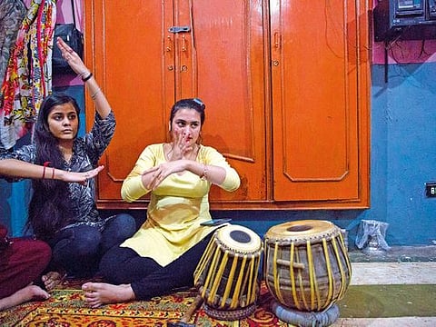 A handout photo provided by Bourne and Shepherd shows professional nautch dancers performing around 1899