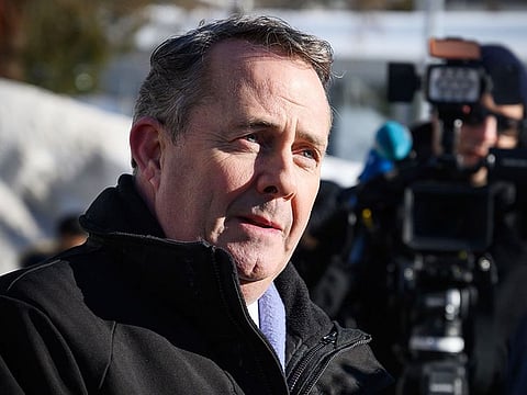 Britain's International Trade Secretary Liam Fox looks on during a TV interview at the World Economic Forum (WEF) annual meeting, on January 23, 2019 in Davos, eastern Switzerland.  