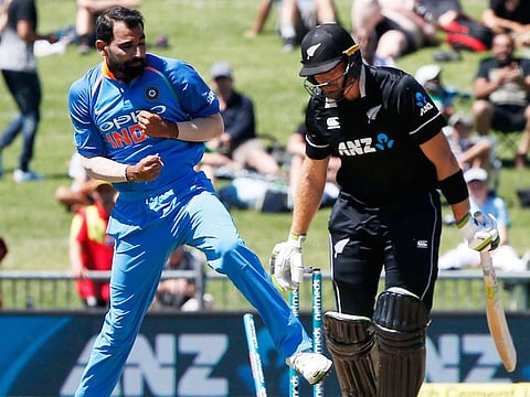India's Mohammed Shami (left) bowls out Martin Guptil and celebrates during the one day international between New Zealand and India in Napier, New Zealand, Wednesday, January 23, 2019. 