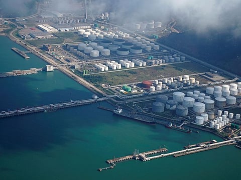 File photo: Oil and gas tanks are seen at an oil warehouse at a port in Zhuhai, China. 