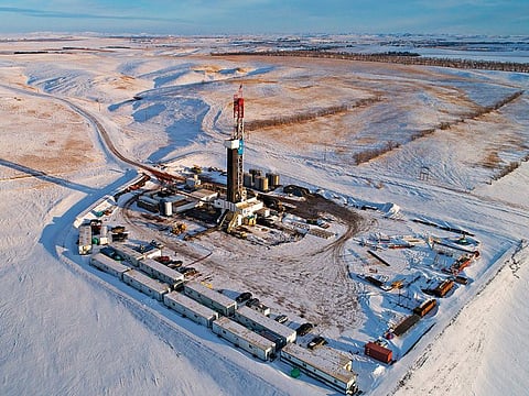 A Unit Drilling Co. rig stands in the Bakken Formation in this aerial photograph outside Watford City, North Dakota. According to the US-based Energy Information Administration (EIA), US crude oil production averaged 10.9 million barrels per day in 2018.