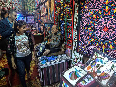 Tourists Khayamiya Street in the old city of the Egyptian capital Cairo. Egypt is the only country in the Middle East and North Africa (MENA) that avoided a negative GDP growth in 2020 despite the impact of COVID-19.