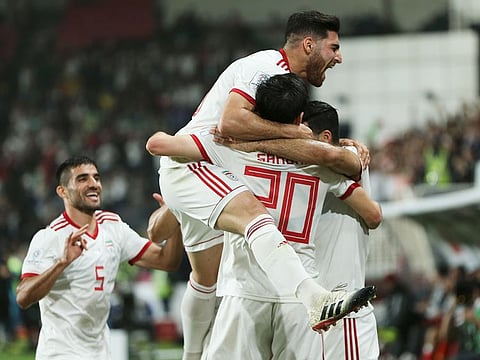 Iran's players celebrate after they scored second goal during the AFC Asian Cup quarterfinal soccer match against China at Mohammad Bin Zayed Stadium in Abu Dhabi, on Thursday. 