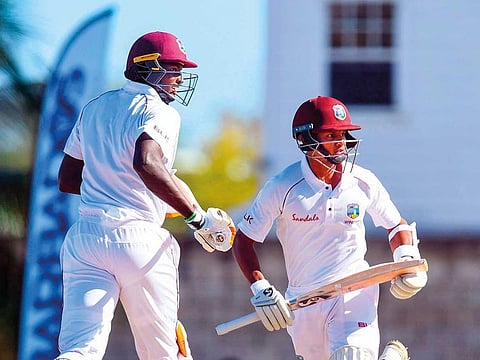 Jason Holder (left) and Shane Dowrich of West Indies put on an unbeaten seventh-wicket partnership of 295.