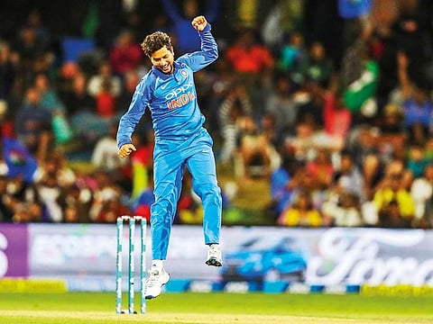 Kuldeep Yadav of India celebrates the wicket of New Zealand’s Ish Sodhi.