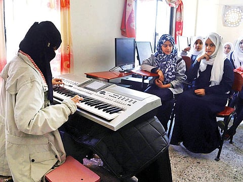 Children attend a music class at the Al Nawras school in Taiz. The school which was hit in 2015-2016 by the ongoing war, recently reopened its doors.