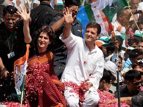 File photo: Rahul Gandhi with his sister Priyanka Vadra waves to supporters on the way to file his nomination papers for Amethi parliamentary seat, in Amethi.