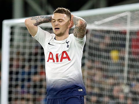 Tottenham's Kieran Trippier reacts after missing a penalty.