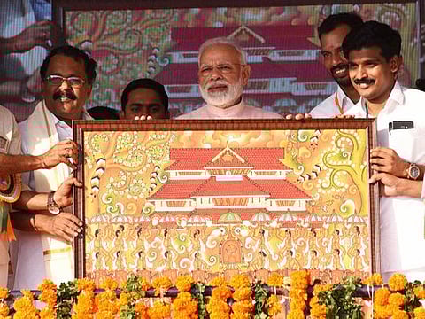 India's Prime Minister Narendra Modi being presented a memento during a meeting at Thrissur, Kerala, on Sunday, January 27, 2019. 