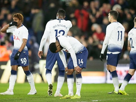 Tottenham's Georges-Kevin Nkoudou, centre, reacts at the end of an English FA Cup fourth round soccer match against Crystal Palace at Selhurst Park in London, Sunday, January 27, 2019. 