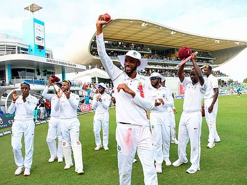 Roston Chase (C) and teammate of West Indies wave to supporters on day 4 of the 1st Test between West Indies and England at Kensington Oval, Bridgetown, Barbados, on January 26, 2019.