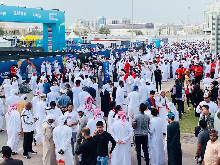 Fans gather outside the stadium