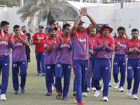 Nepal's national cricket team celebrate after beating UAE in the third and final match of the One-Day International series in ICC Academy in Dubai. 