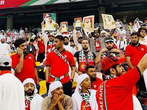 Football fans gather outside the Mohammad Bin Zayed stadium.