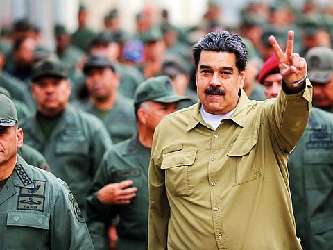 Maduro flashing the V-sign during a military rally at Fuerte Tiuna Military Complex, in Caracas,