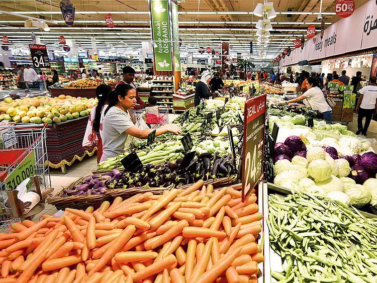 People shop at Carrefour Hypermarket in City Centre Mirdif