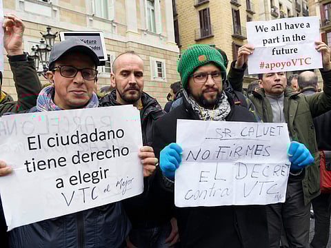 VTC (Tourism Vehicles with Chauffeur) companies' drivers gather in front of Catalonia's regional government headquarters in Barcelona on January 29, 2019, to protest against a new decree.