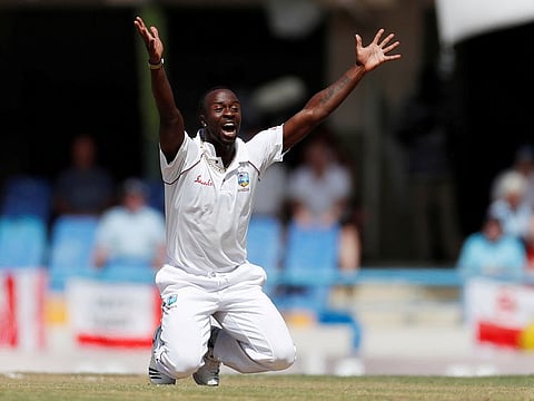 West Indies' Kemar Roach celebrates the wicket of England's Jonny Bairstow.
