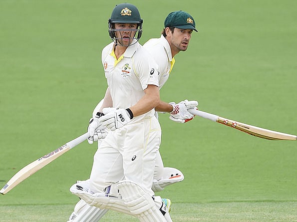 Australia's Travis Head (L) and Joe Burns