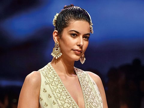 A model walks the ramp showcasing a collection by designer Anita Dongre