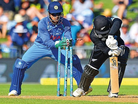 Mahendra Singh Dhoni (L) stumps New Zealand's Lockie Ferguson (R) during the first one-day international (ODI) cricket match at McLean Park in Napier on January 23, 2019. 