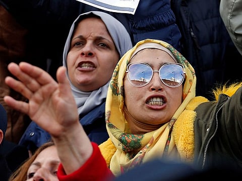 Parents of Tunisian pupils hold placards and shout slogans during a demonstration against the general union of secondary education in Tunis, Tunisia February 1, 2019.