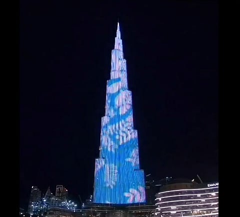 The world's tallest tower lights up in blue and white to celebrate the visit of Pope Francis in the UAE.