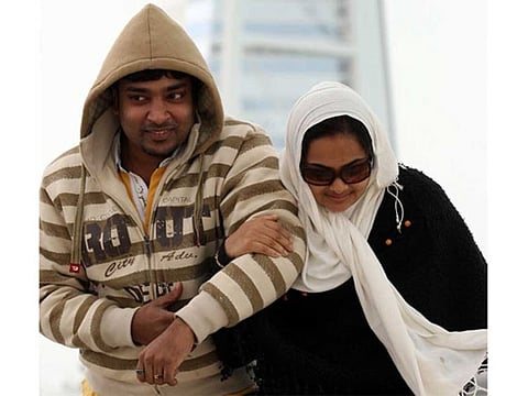 A young couple braves the cold weather in Dubai's Jumeirah beach. 