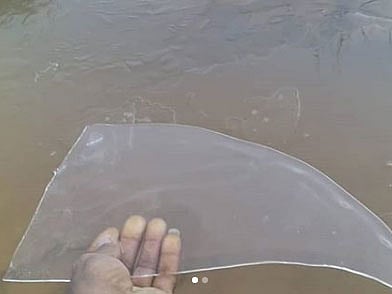 A resident holds a sheet of ice found near Jebel Jais, Ras Al Khaimah.