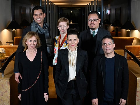 The Berlinale film festival International Jury (bottow row) British actress and producer Trudie Styler, French actress and president of the Berlinale 2019 jury Juliette Binoche and Chilean film director Sebastian Lelio (top row) US Chief Curator of Film at MoMA Rajendra Roy, German actress Sandra Hueller and US Film critic Justin Chang.