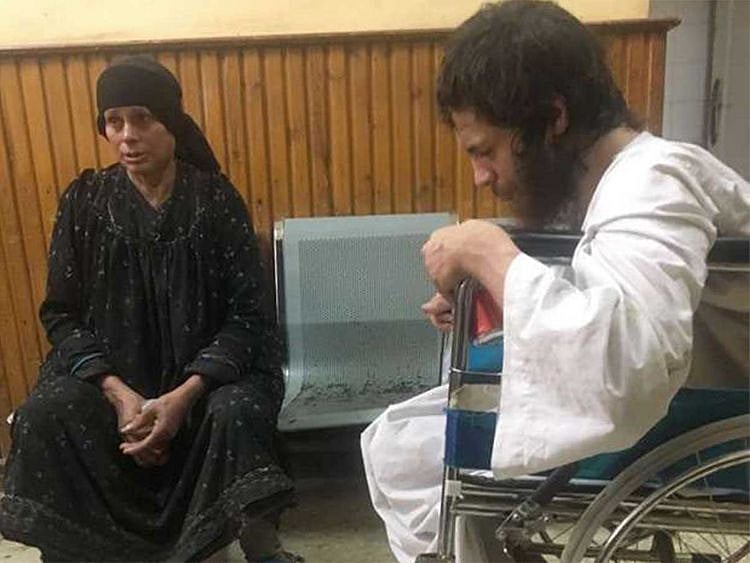 A boy (right) allegedly kept by his mother