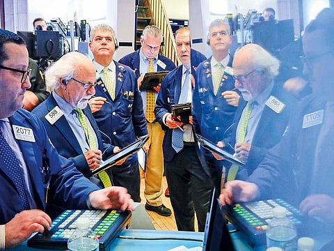 Traders at the New York Stock Exchange. Wall Street expects fourth-quarter earnings growth of 14.5 per cent for the S&P 500’s consumer discretionary index.