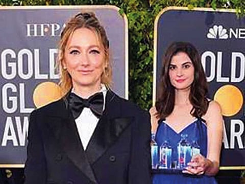Fiji Water Girl (right) at the Golden Globes