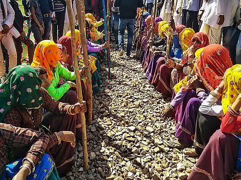 Members of the Gujjar community hold a dharna demanding reservation, in Sawai Madhopur, Saturday, Feb  9, 2019.