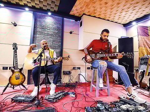 Hani Al Dakkak, lead singer and guitarist, and Mahmoud Siam, guitarist for rock band Massar Egbari.