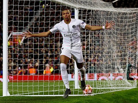 Paris St Germain's Kylian Mbappe celebrates scoring their second goal.
