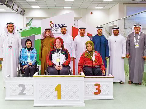German Elke Seeliger, Uzbek shooter Malika Kenjaeva, Emirati shooter Latifa Al Suwaidi (left, front) and Emirati sport officials during the awards ceremony.