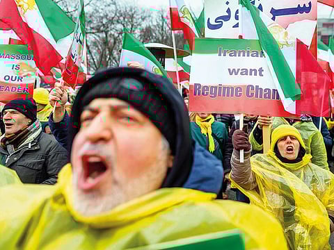 People demonstrate with banners and placards during a rally of supporters of the National Council of Resistance of Iran, demanding tougher policy on Iran and its violation of human rights in Warsaw on February 13, 2019.
