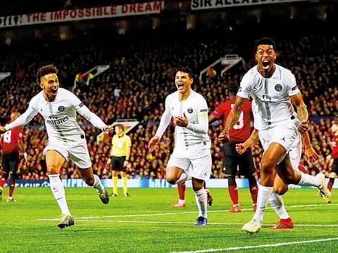 Presnel Kimpembe (right) celebrates with Thiago Silva and Thilo Kehrer after scoring PSG’s first goal at Old Trafford in Manchester on Tuesday night.