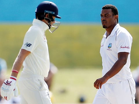 West Indies' Shannon Gabriel and England's Joe Root on the field during the third Test at the Darren Sammy National Cricket Stadium, in St Lucia on February 12, 2019. 