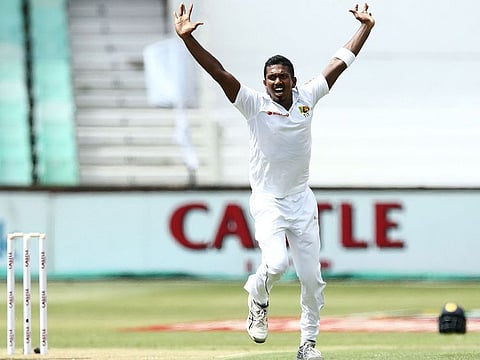 Sri Lanka's Vishwa Fernando appeals and gets the wicket of South Africa's Dean Elgar in the second over during day 1 of the first Test cricket match between them at the Kingsmead Stadium in Durban on February 13, 2019.  